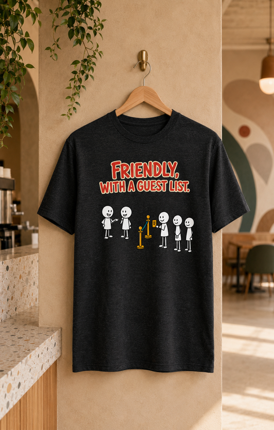 The Guest List black unisex graphic T-shirt displayed on a wooden hanger