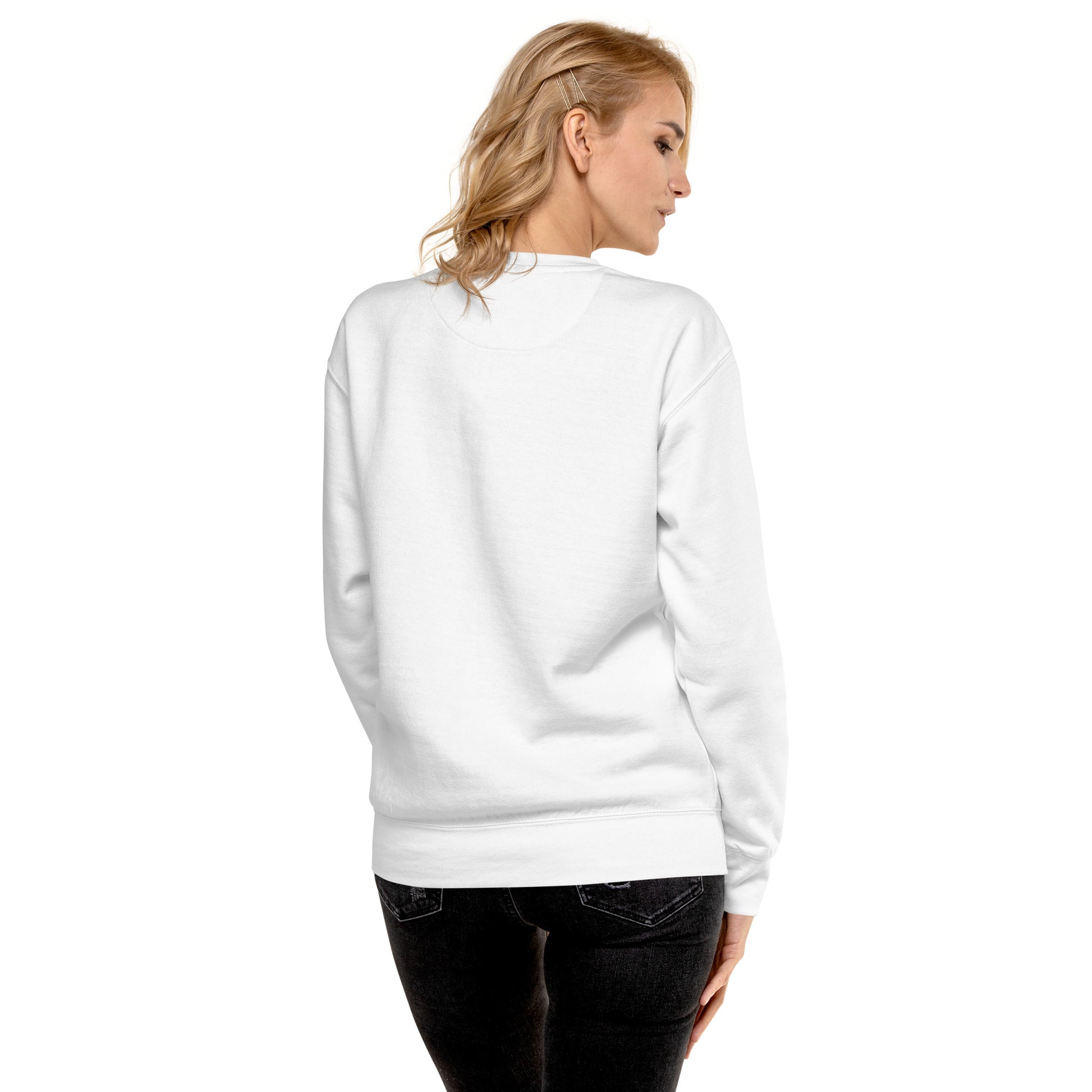 Person wearing a white sweatshirt on a plain background